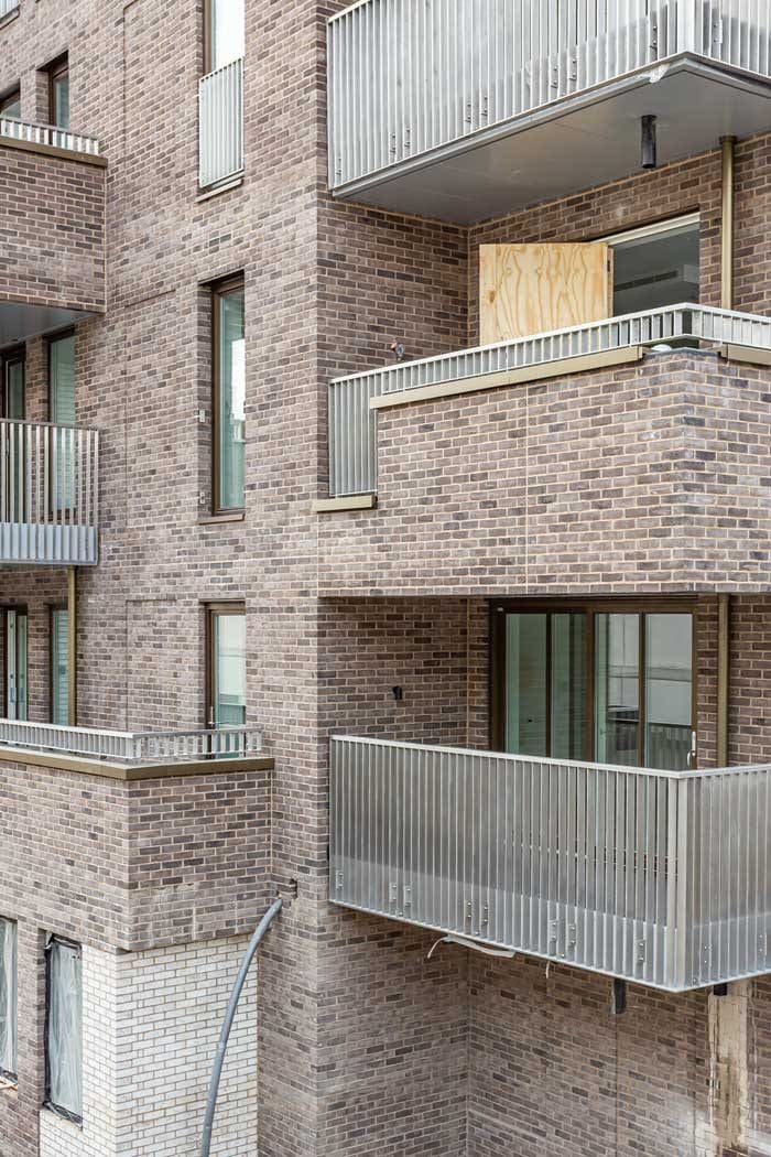 Alternating balcony facades make for an eye-catching building design