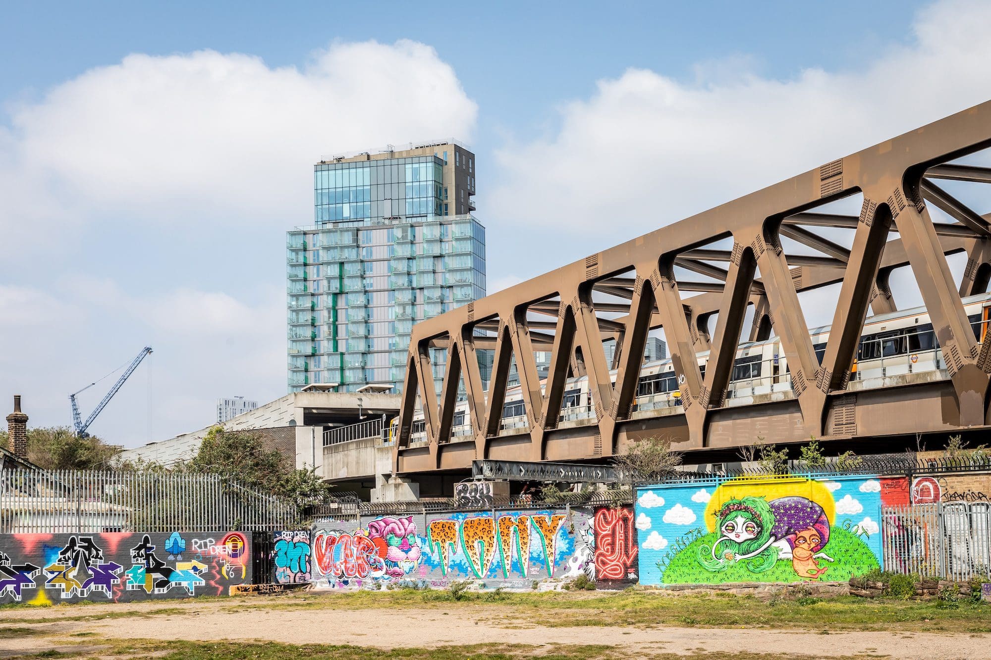 Avant Garde balconies with railway bridge and graffiti